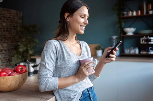 Woman reading a flirty "Have a good day" text message