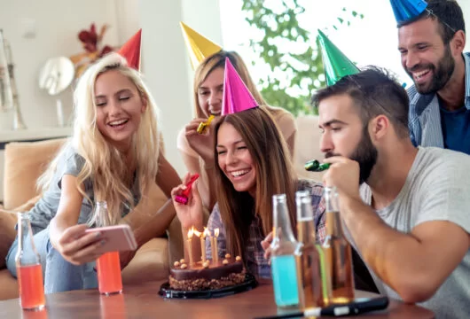 Young woman celebrating her birthday with friends
