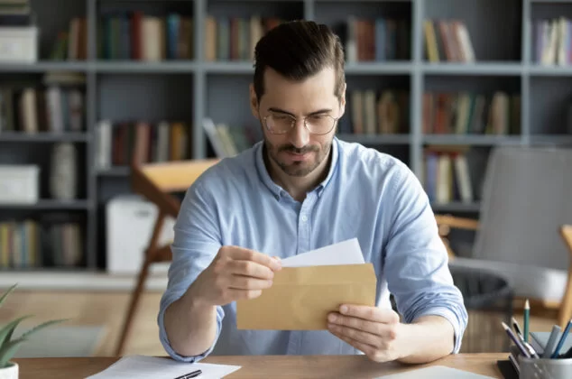 Man reading a letter to a son making bad choices