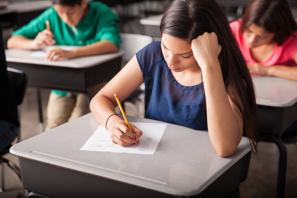 Focused female student taking an exam