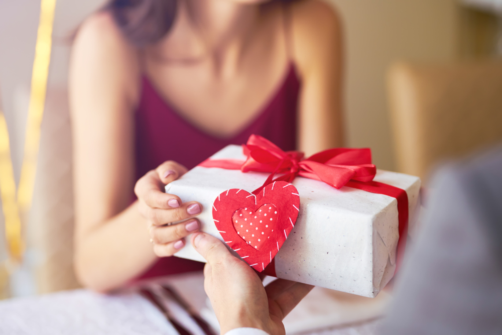 Woman receiving a Valentine's Day gift