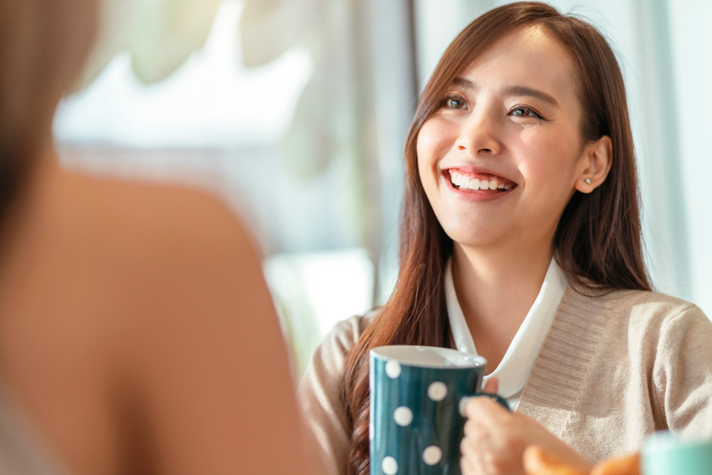 Woman smiling after hearing "I appreciate you"