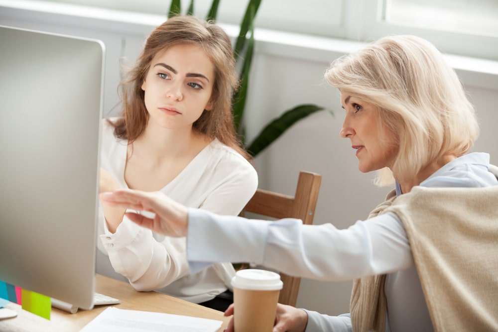 Business woman advising an intern