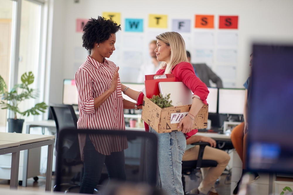 Woman saying farewell to a colleague in the office