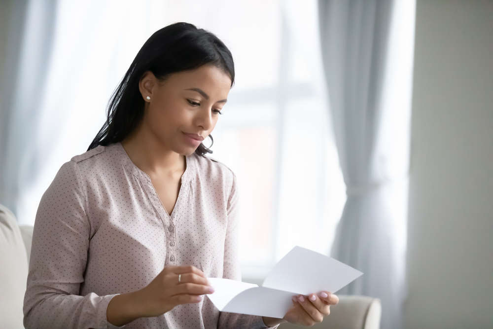 Woman reading a Karios letter