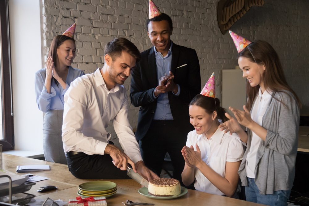 Co-workers celebrating their colleague's work anniversary