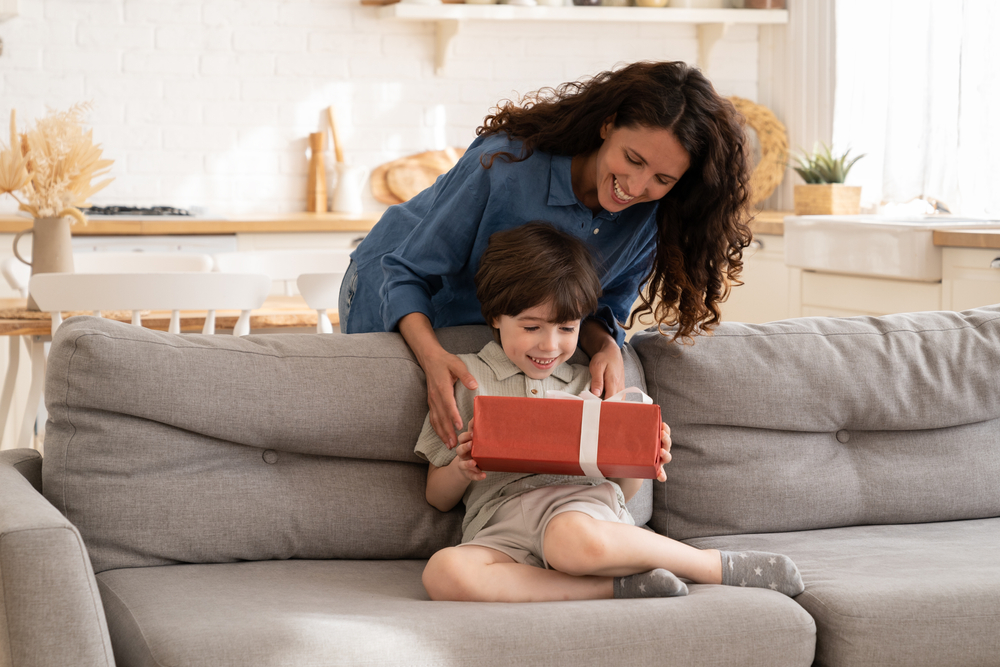 Woman giving a birthday gift to her nephew