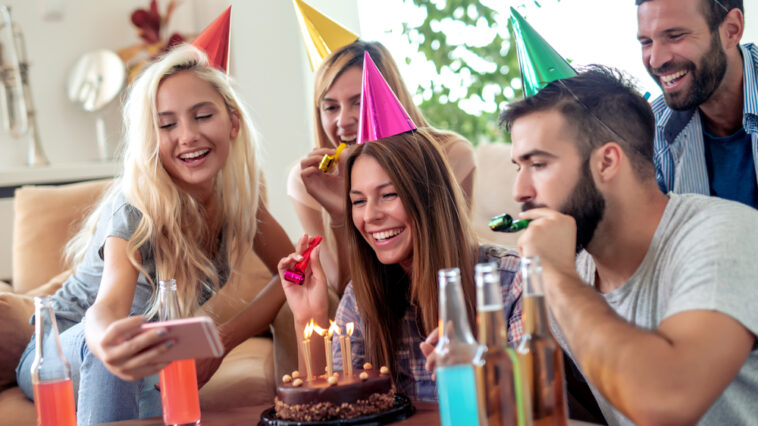 Young woman celebrating her birthday with friends