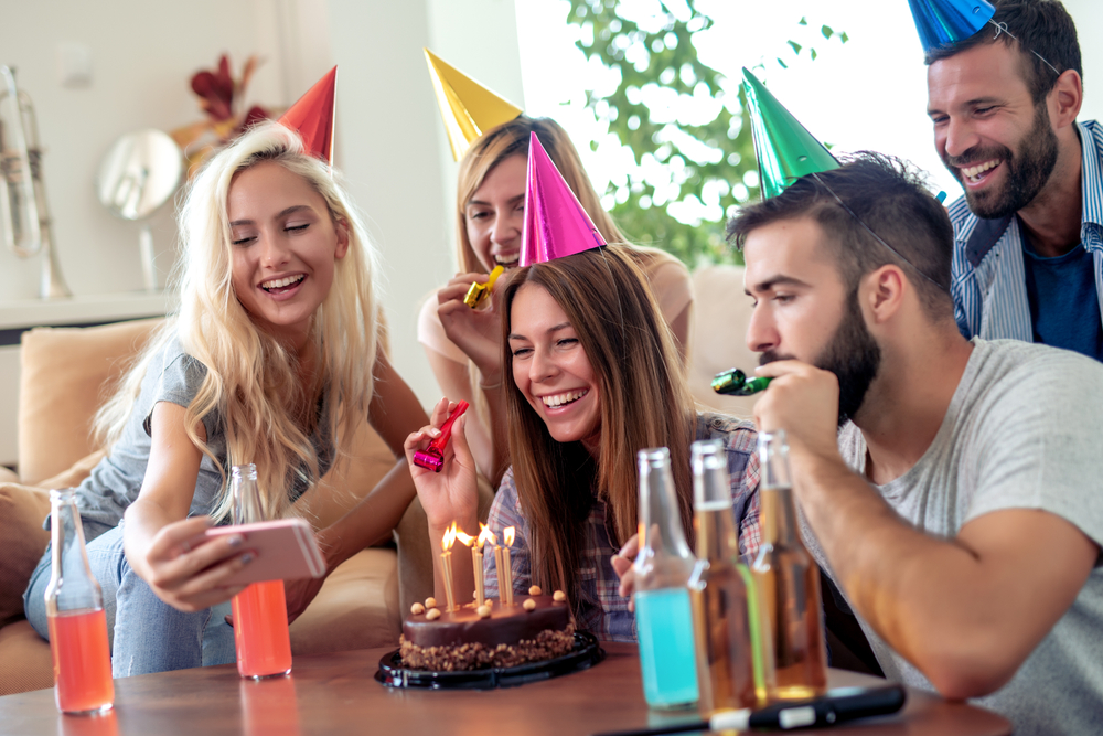 Young woman celebrating her birthday with friends