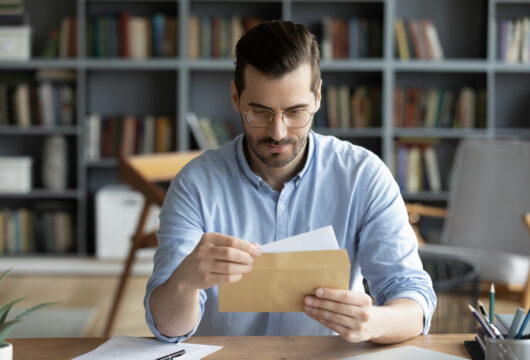 Man reading a letter to a son making bad choices
