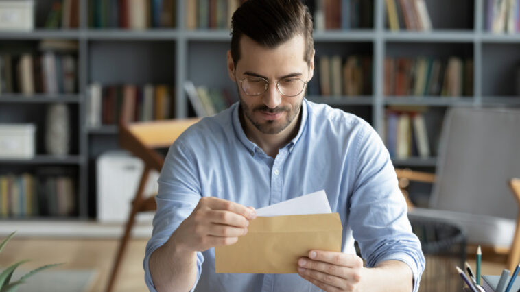 Man reading a letter to a son making bad choices